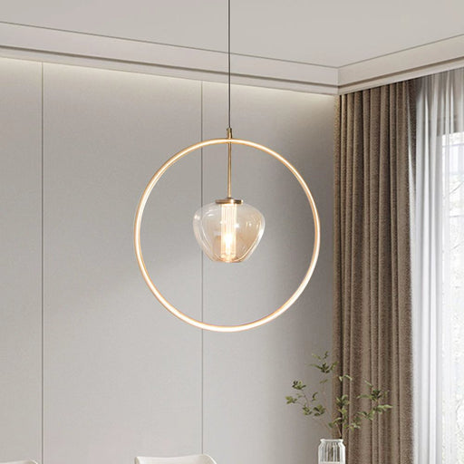 Modern dining room with a round pendant light, white table, and chairs.